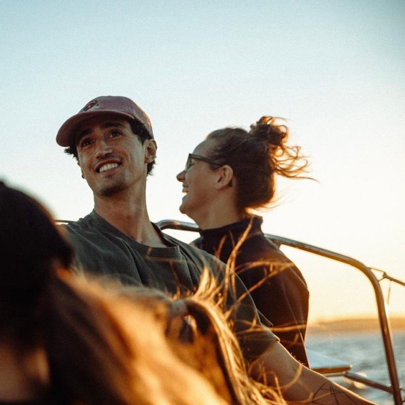 Henry laughing on deck at sunset
