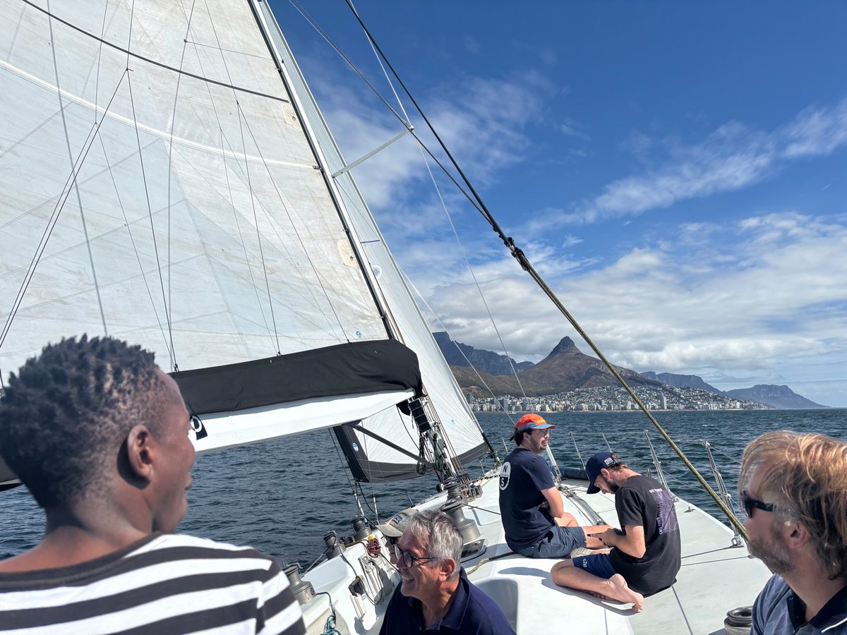 Day crew on Warrior's deck under sail